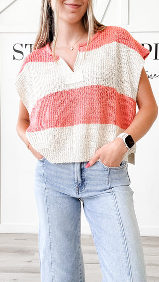 Woman wearing a striped sleeveless top and jeans 