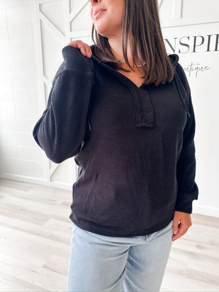 Black sweater with a hood