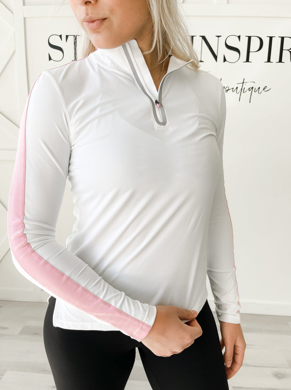 Fit: Mock neck to a half zip pullover. Jaquard stripe at the sleeves and collar. Side seam vents. Reflecting tape at the front zipper.  Style: Getting that workout in right away might require a light coverup. This light pullover is perfect for all of your on the go activities! Four-way stretch will move with you while you reach your goals! The reflective tape by the front zipper will catch the light during those early morning runs!
