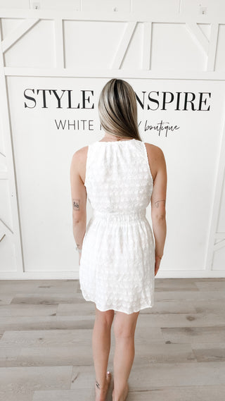 Brielle Eylet Surplice Mini Dress