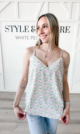 Woman wearing a floral camisole.
