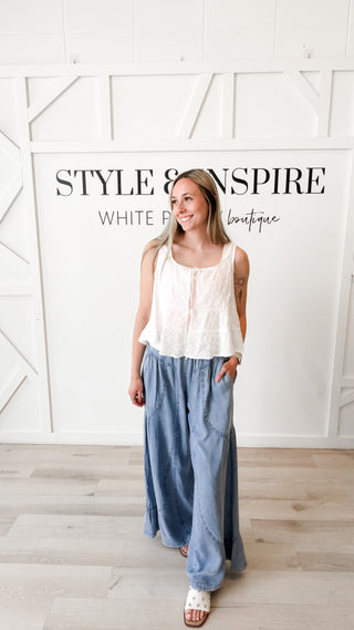 Woman wearing flowy tencel ruffle pants
