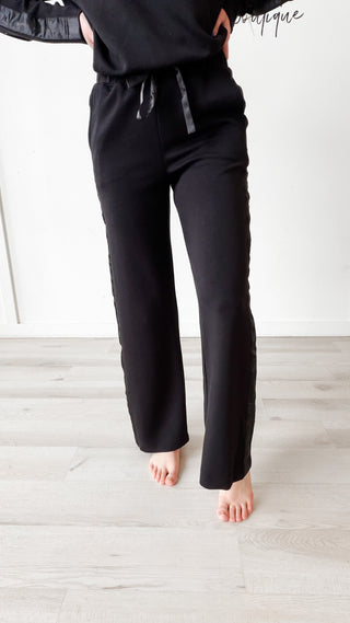 black sweatpants with satin stripe down side and drawstring
