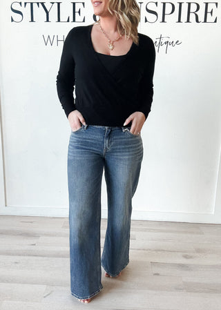 mid rise, wide leg, medium wash denim jeans. 