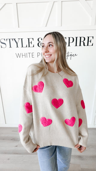 crewneck, cream sweater with pink heart pattern