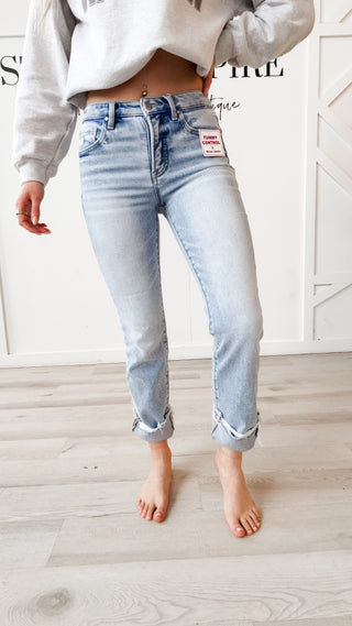 light denim jeans. no distressing. cuff at bottom. tummy control