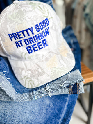 Pretty Good At Drinkin' Camo Trucker Hat