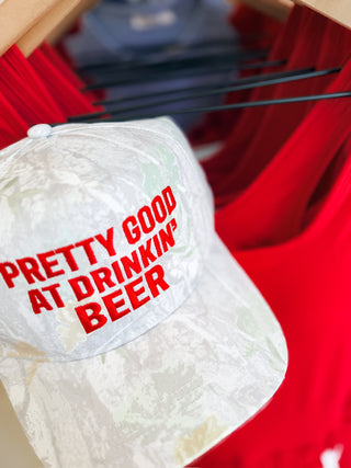 Pretty Good At Drinkin' Camo Trucker Hat