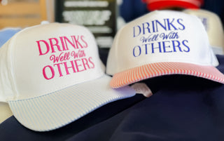 Drinks Well With Others Trucker Hat