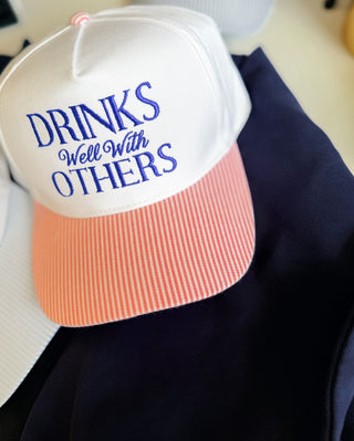 Drinks Well With Others Trucker Hat