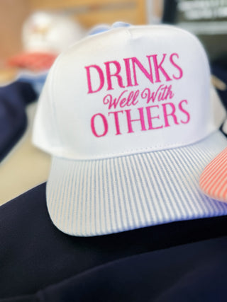 Drinks Well With Others Trucker Hat