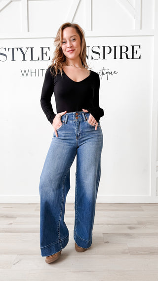 Risen High Rise Wide Hem Jeans