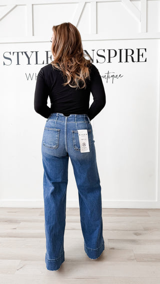 Risen High Rise Wide Hem Jeans