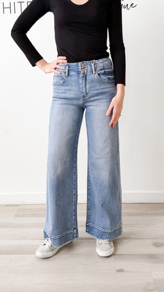 Risen High Rise Wide Hem Jeans