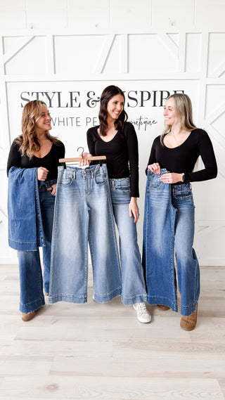 Risen High Rise Wide Hem Jeans